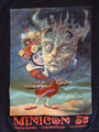Small image of the Minicon 53 t-shirt: art of a whimsical fellow holding up a frightening mask, under which it says 'Minicon 53: Rachel Swirsky - Lyda Morehouse - Jon Arfstrom'